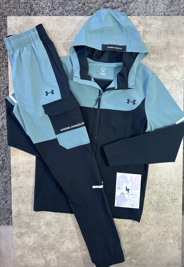 Under Armour tracksuit with jacket and pants on a textured surface